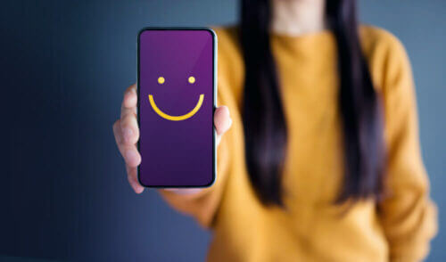 Close up of phone with happy face